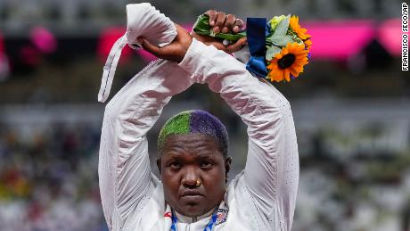 Raven Saunders performs her Protest X on the podium in Tokyo. 