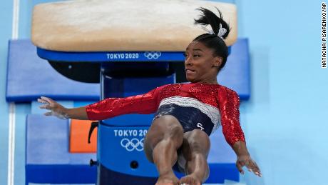 Simone Biles performs on the jump during the women's final in Tokyo