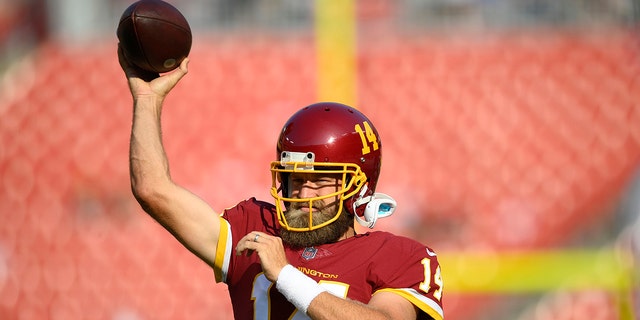 Washington FC quarterback Ryan Fitzpatrick during the pre-game warm-up before the start of the first half of a pre-season football game against the Baltimore Ravens, Saturday, Aug. 28, 2021, in Landover, Maryland (AP Photo/Nick Wass)