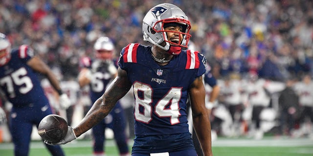 October 3, 2021;  Foxboro, Massachusetts, USA;  Kendrick Bourne (84), the wide receiver of the New England Patriots, celebrates landing through the end of Fisherman's Court Henry (not pictured) against the Tampa Bay Buccaneers during the second quarter at Gillette Stadium.