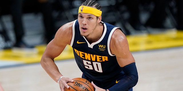 Denver Nuggets forward Aaron Gordon looks to pass the ball during the second half of an NBA basketball game against the Orlando Magic on Sunday, April 4, 2021 in Denver.