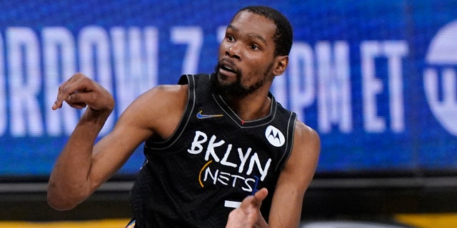 Brooklyn Nets forward Kevin Durant is seen making a three-point shot during the fourth quarter of Game 5 of the second round of the NBA basketball playoff series against the Milwaukee Bucks, Tuesday, June 15, 2021, in New York.