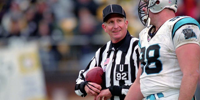 NFL referee Karl Madsen speaks to 98th linebacker Shane Burton of the Carolina Panthers during a game against the Pittsburgh Steelers at Heinz Field on December 15, 2002 in Pittsburgh, Pennsylvania.  