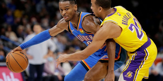 Oklahoma City Thunder guard Shay Gilgus Alexander (2) faces Los Angeles Lakers guard Avery Bradley (20) during the second half of an NBA basketball game, Wednesday, Oct. 27, 2021, in Oklahoma City.