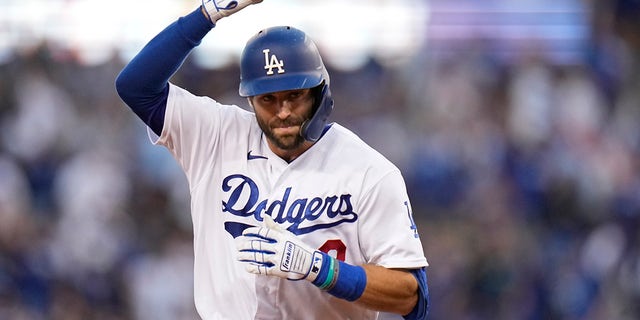 Chris Taylor of the Los Angeles Dodgers celebrates his two-time home run in the second half against the Atlanta Braves in Game Five of the National League Baseball Series on Thursday, October 21, 2021, in Los Angeles.  Pujols scored on strike.