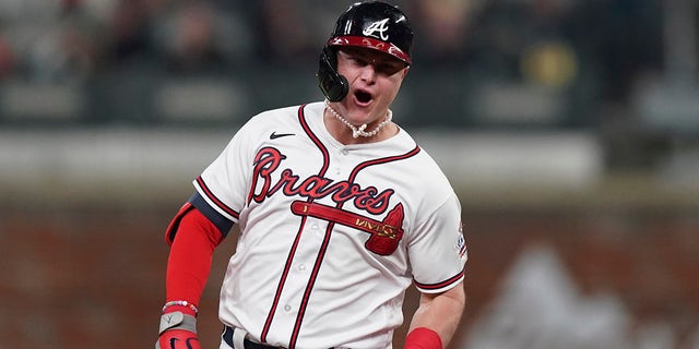 Atlanta Braves' Jock Pederson celebrates after hitting a home double during the fourth inning in Game Two of the National League Baseball Series against the Los Angeles Dodgers on Sunday, October 17, 2021, in Atlanta.