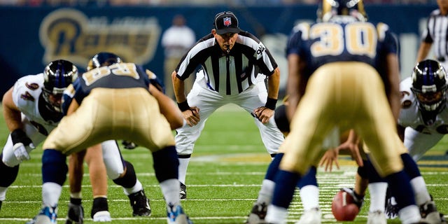 NFL Umpire Carl Madsen stands in position during game action between the St. Louis Rams and the Baltimore Ravens at the Edward Jones Dome on August 23, 2008 in St. Louis, Missouri.  (Photo by Dilip Vishwanat / Getty Images)