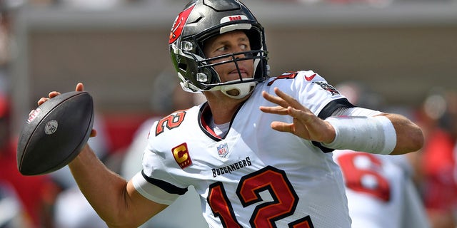 Tampa Bay Buccaneers quarterback Tom Brady (12) throws a pass against the Miami Dolphins during the first half of an NFL football game Sunday, October 10, 2021 in Tampa, Florida.