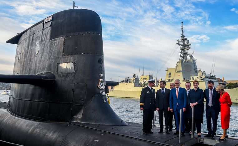 President Macron (second from left) who visited Australia in 2018 with Australian Prime Minister Malcolm Turnbull (fourth from left) was to buy 12 French submarines from Australia, but has now opted for nuclear-powered submarines with US technology.  Image Getty Images