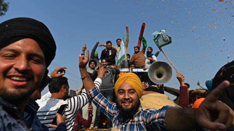 Indian farmers leave protest sites after a year of protests