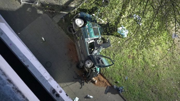 About 18 meters under the wreckage of a green Volkswagen Golf on the driver's side.  Police suspect that the car first hit a tree and then hit the sidewalk with full force.