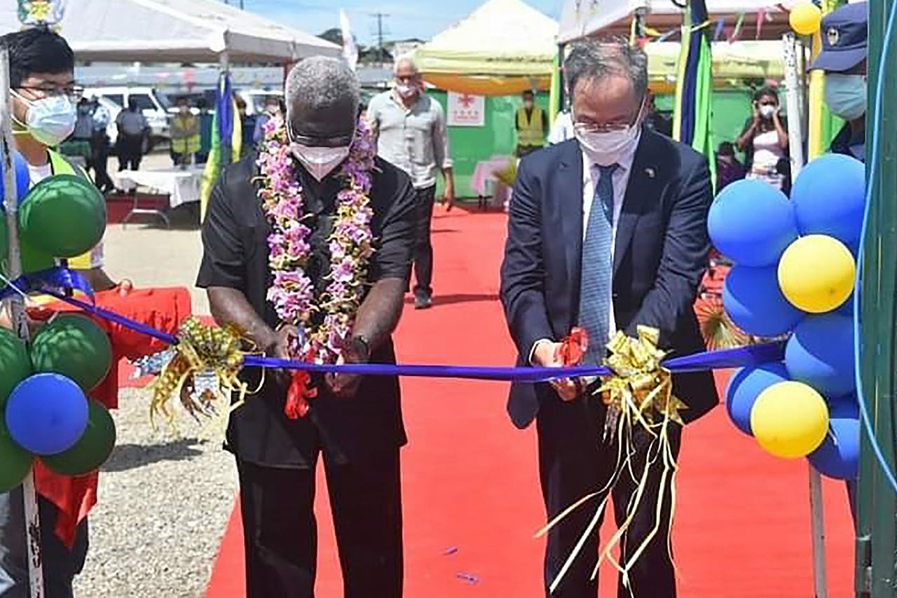 Prime Minister Manasseh Chowdhury (L) and Chinese Ambassador to the Solomon Islands Li Ming (R) inaugurated the Chinese-funded National Stadium in the capital, Hon'ble, next year's Pacific Games.