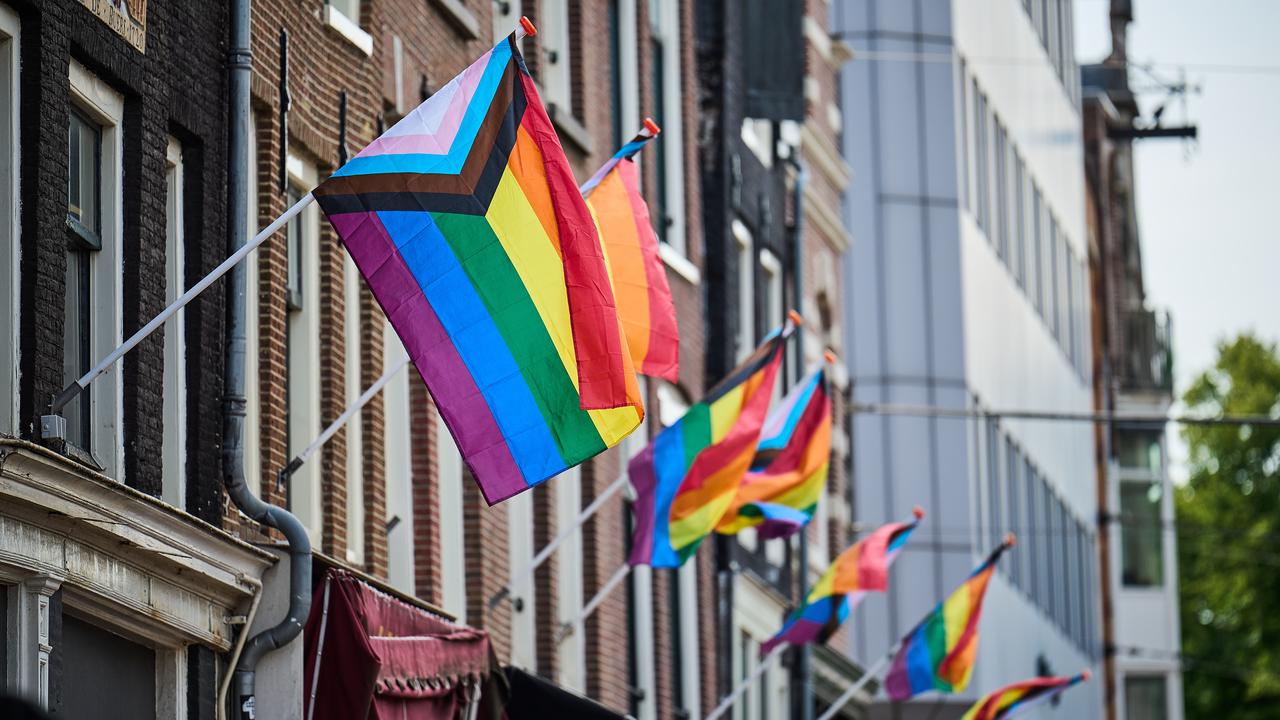 Rainbow flags hang from facades all over the city.