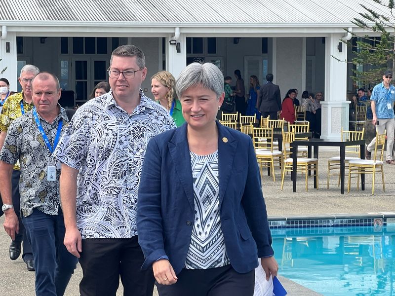Australian Foreign Minister Penny Wong walks outside the Grand Pacific Hotel, the venue for the Pacific Islands Forum, in Suva