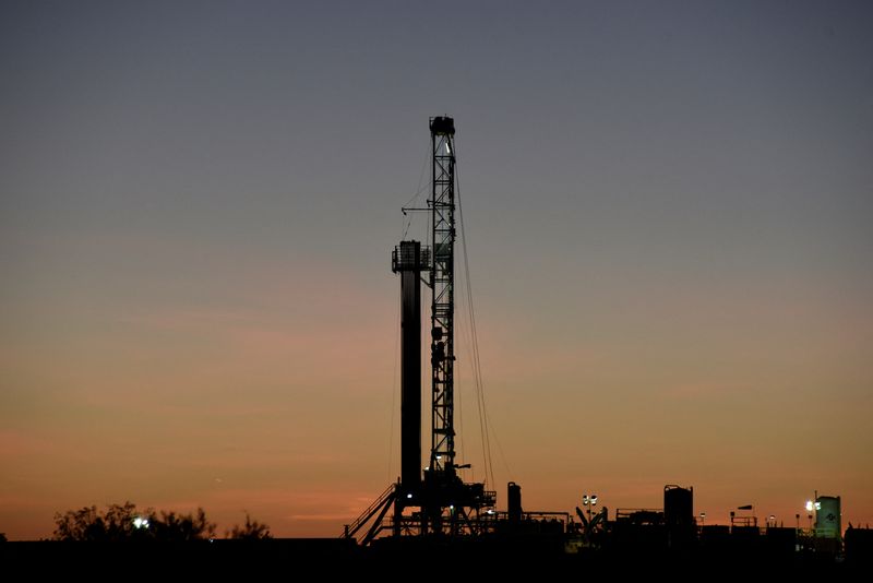 FILE PHOTO: A horizontal drilling rig on a lease owned by Parsley Energy operates at sunrise in the Permian Basin near Midland