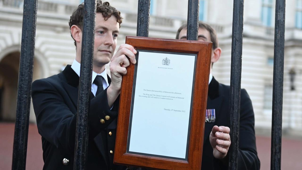 Buckingham Palace officials have hung the official notification of the death on the gate.