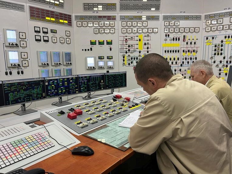 Ukrainian engineers in the control room of the Zaporizhzhya nuclear power plant.  They work there under the supervision of Russian soldiers.  Reuters photo