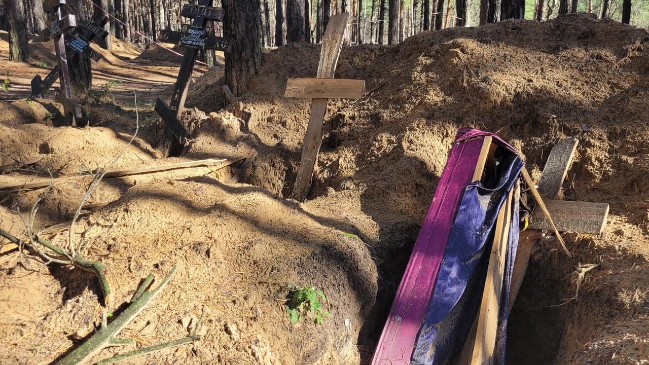 A mass grave was discovered in a forest on the outskirts of the city of Izyum.