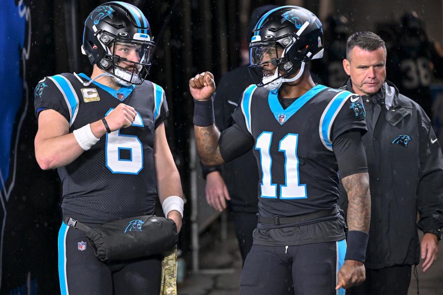 (From left) Panthers midfielder Baker Mayfield and PJ Walker before the Carolinas' game against the Atlanta Falcons on November 10, 2022.