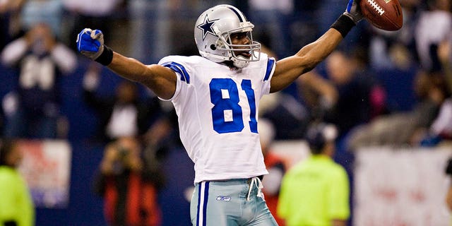 Terrell Owens of the Dallas Cowboys celebrates after scoring against the Seattle Seahawks at Texas Stadium in Irving, Texas, on November 27, 2008.