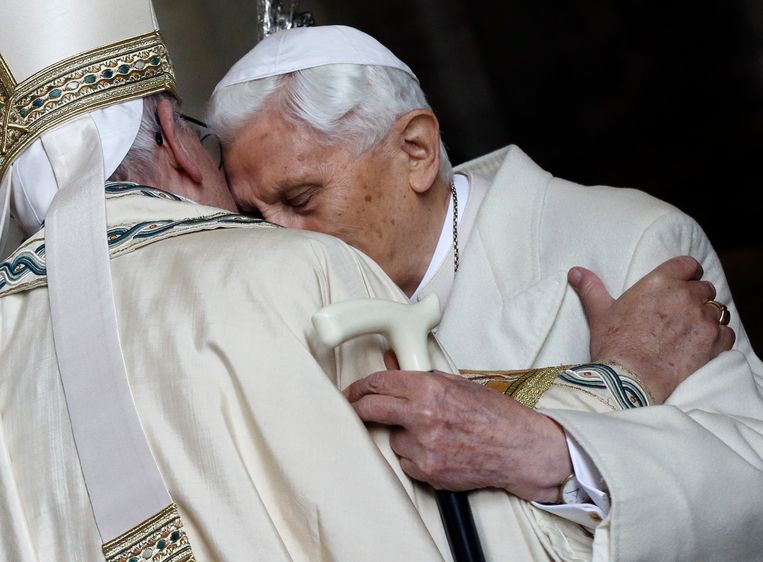 A papal embrace between Benedict XVI (right) and Francis in St. Peter's Basilica, marking the beginning of the Holy Year on December 8, 2015. Image Gregorio Borgia/AP