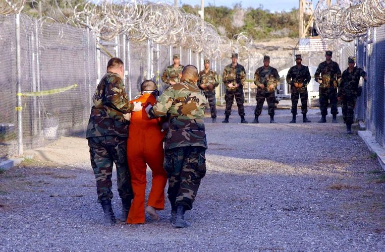 In 2015, soldiers escorted a detainee to his cell at Guantanamo Bay.  Image courtesy EPA