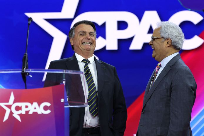 Jair Bolsonaro (left) takes the stage for a moment.