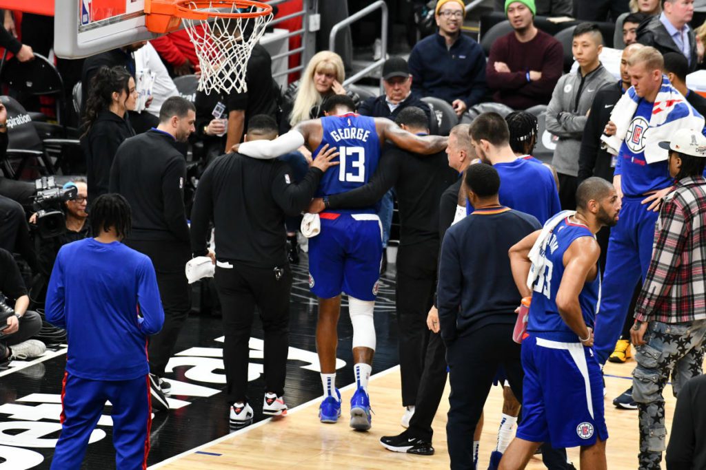 Paul helped George off the court after an apparent knee injury to the Thunder-Clippers