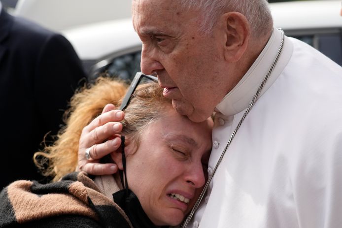 Pope Francis comforts Serena Sobaña as she leaves hospital, who lost her 5-year-old daughter, Angelica, in the same hospital.