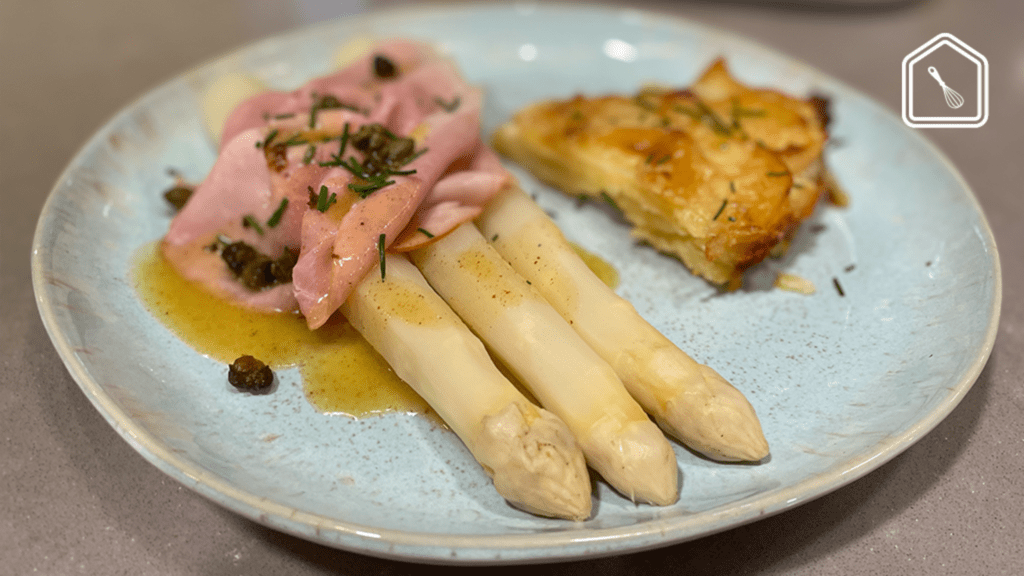 White asparagus with bourre noisette sauce and potato gratin