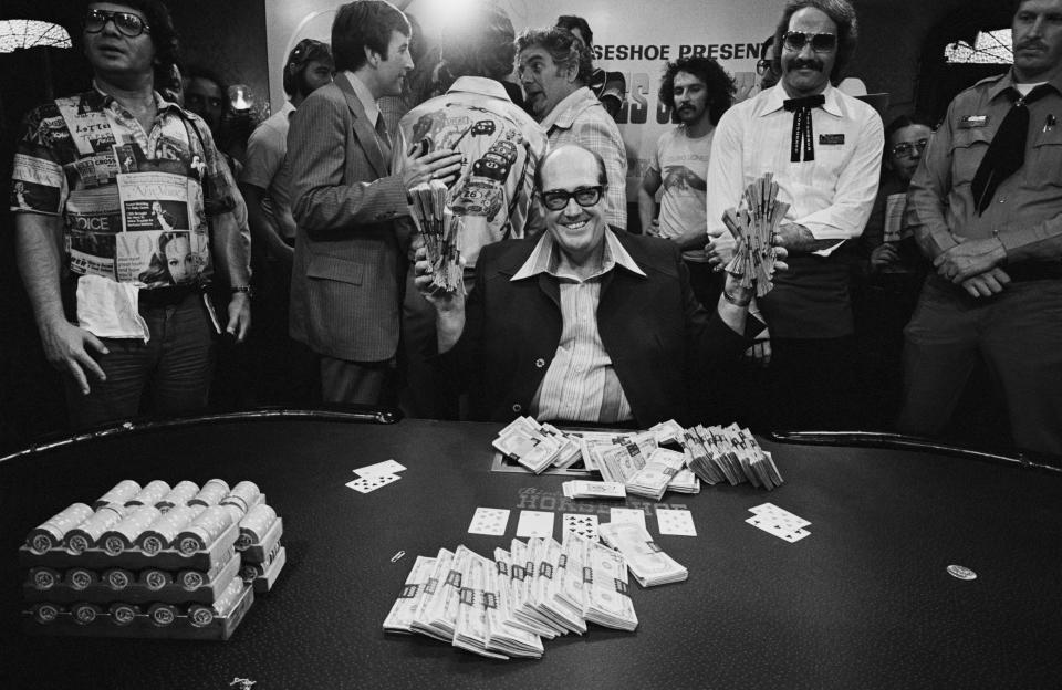 Doyle Brunson, shown here with his $340,000 cash prize after winning the 1977 World Series of Poker Main Event. (Tony Corody/Sigma/Sigma via Getty Images)