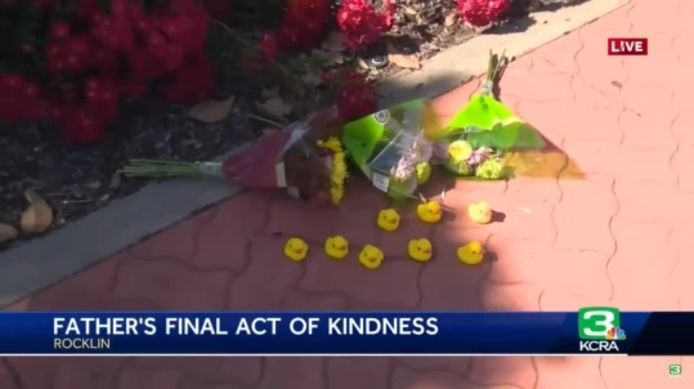 A touching memorial with flowers and rubber ducks to the man who saved ducks before he died.