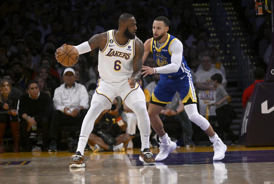 Los Angeles Lakers star LeBron James controls the ball against Golden State Warriors star Stephen Curry during Game 3 of the Western Conference Semifinals series at Crypto.com Arena in Los Angeles on May 6, 2023. (Keith Birmingham/MediaNews Group/Pasadena Star -News via Getty Images)