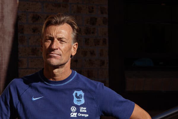 Herve Renard, in a blue football shirt