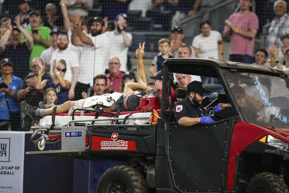 YES Network photographer Pete Stendel was hit in the head by a wild pitch and stretched out of the field during the Yankees' shot.  Loss to the Orioles on Wednesday at Yankee Stadium.  (AP/Frank Franklin II)