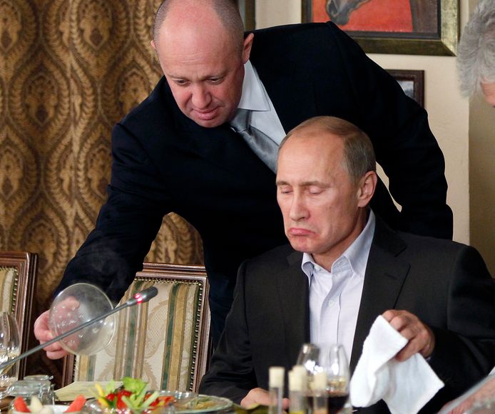 Prigozhin serves poutine in one of his restaurants.