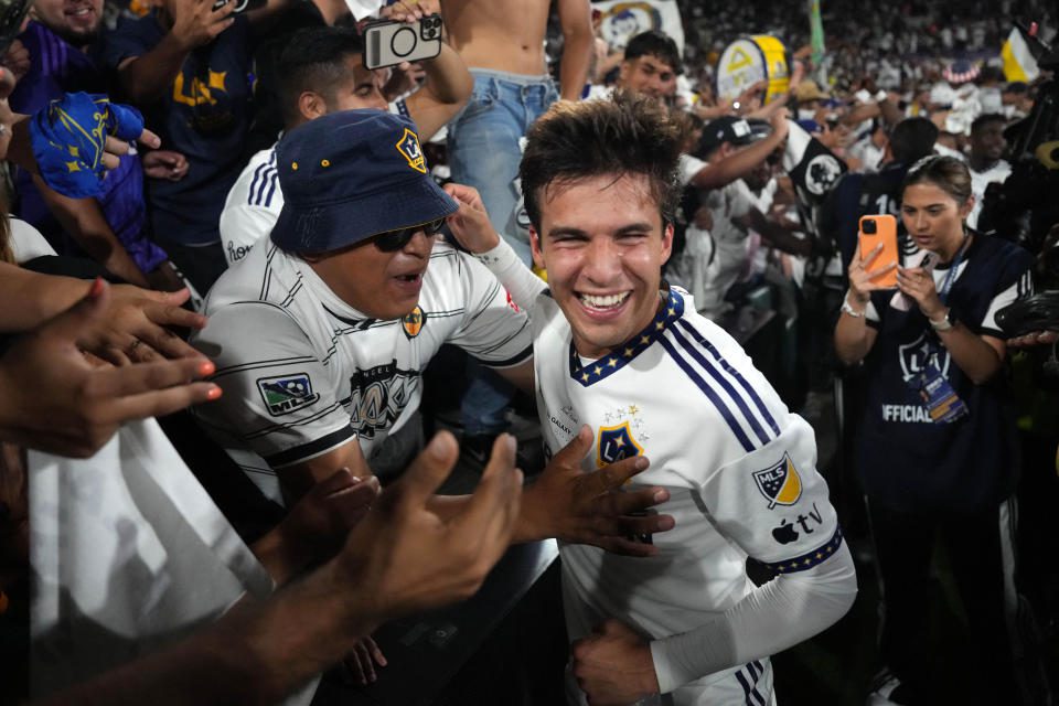 July 4, 2023;  Los Angeles, California, USA;  Los Angeles Galaxy midfielder Riqui Puig (6) celebrates with fans after the game against LAFC at the Rose Bowl.  Mandatory credit: Kirby Lee-USA TODAY Sports