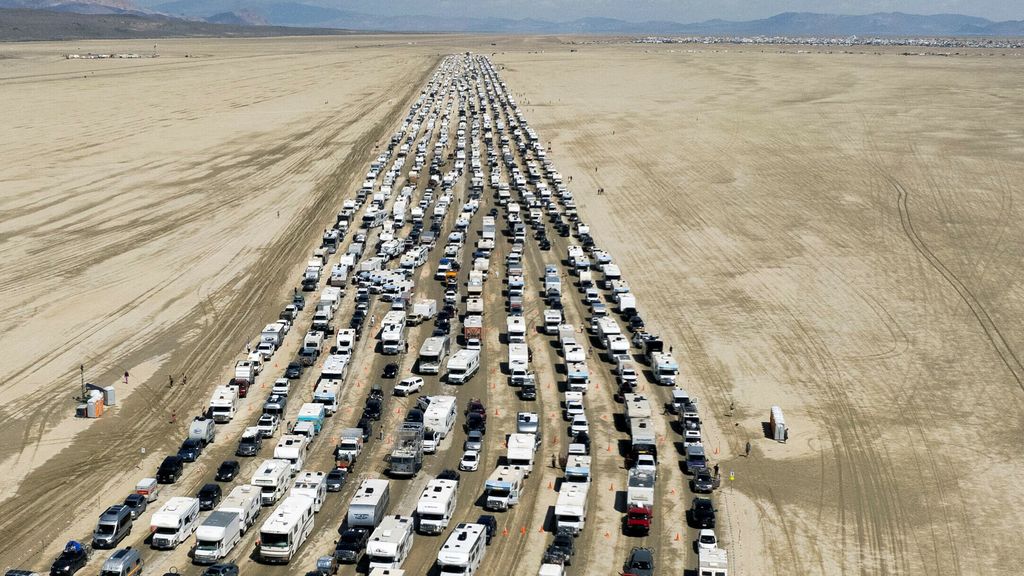 Visitors to the Burning Man festival return home after spending days in the mud