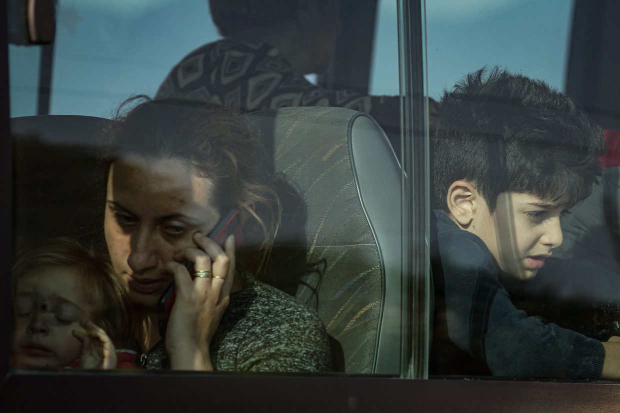 Refugees wait on a bus after registering at the Armenian Foreign Ministry office near the border town of Kurandzor on September 24, 2023. AFP Photo