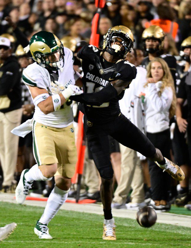 BOULDER, Colo., Sept. 16: Colorado's Travis Hunter, right, is injured during this game against Colorado State in Boulder on Sept. 16, 2023. (Cliff Grasmick/Staff Photographer)