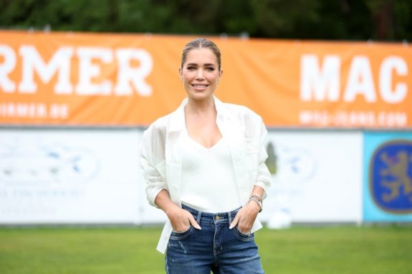 Sylvie Mays encourages her son on the sidelines and shares a snapshot with him
