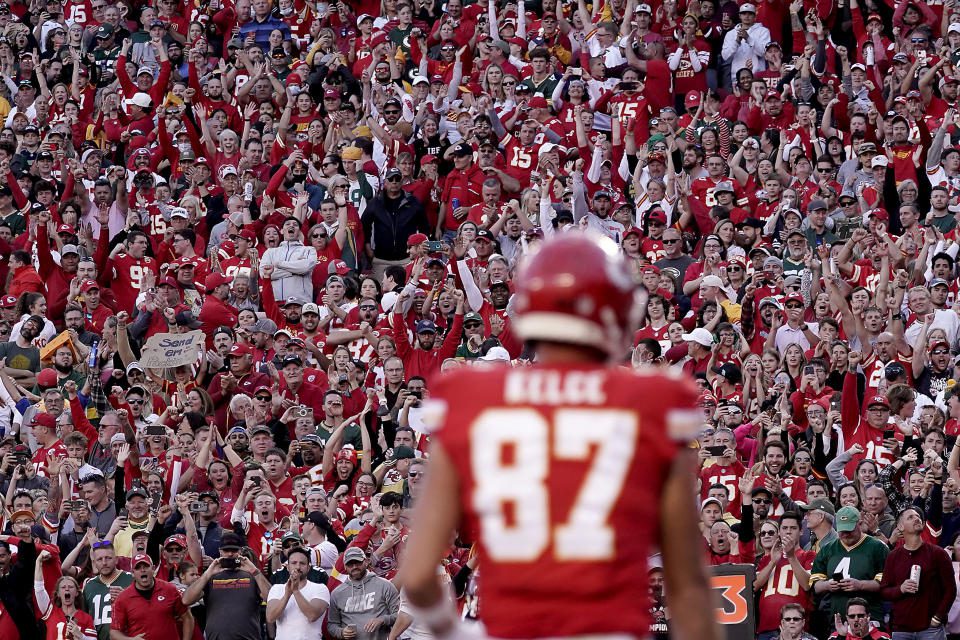 FILE - Fans cheer after Kansas City Chiefs tight end Travis Kelce scores (87) a touchdown during the first half of an NFL football game against the Green Bay Packers Sunday, Nov. 7, 2021, in Kansas City, MO Taylor Swift and Travis Kelce remains silent about his situation since the pop star started attending tight end Kansas City Chiefs football games.  However, the NFL wants to have fun, with a team of people monitoring social media to see where you can be part of the phenomenon with many memes and trends emerging.  (AP Photo/Charlie Riddell, File)
