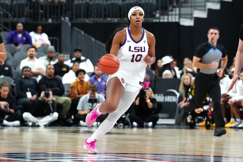 November 6, 2023;  Las Vegas, Nevada, USA;  LSU Lady Tigers forward Angel Reese (10) dribbles against the Colorado Buffaloes during the first quarter at T-Mobile Arena.  Mandatory credit: Stephen R.  Silvani-USA TODAY Sports