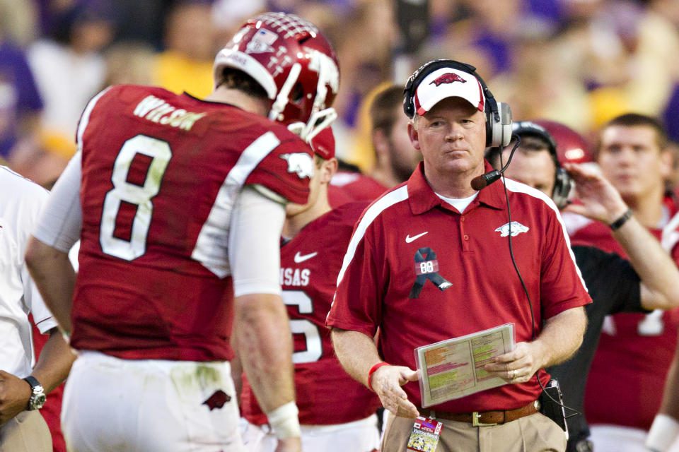 BATON ROUGE, LA - NOVEMBER 25: Head coach Bobby Petrino and quarterback Tyler Wilson #8 of the Arkansas Razorbacks on the sideline during a timeout against the LSU TIgers at Tiger Stadium on November 25, 2011 in Baton Rouge, Louisiana.  The Tigers defeated the Razorbacks, 41 to 17. (Photo by Wesley Hitt/Getty Images)