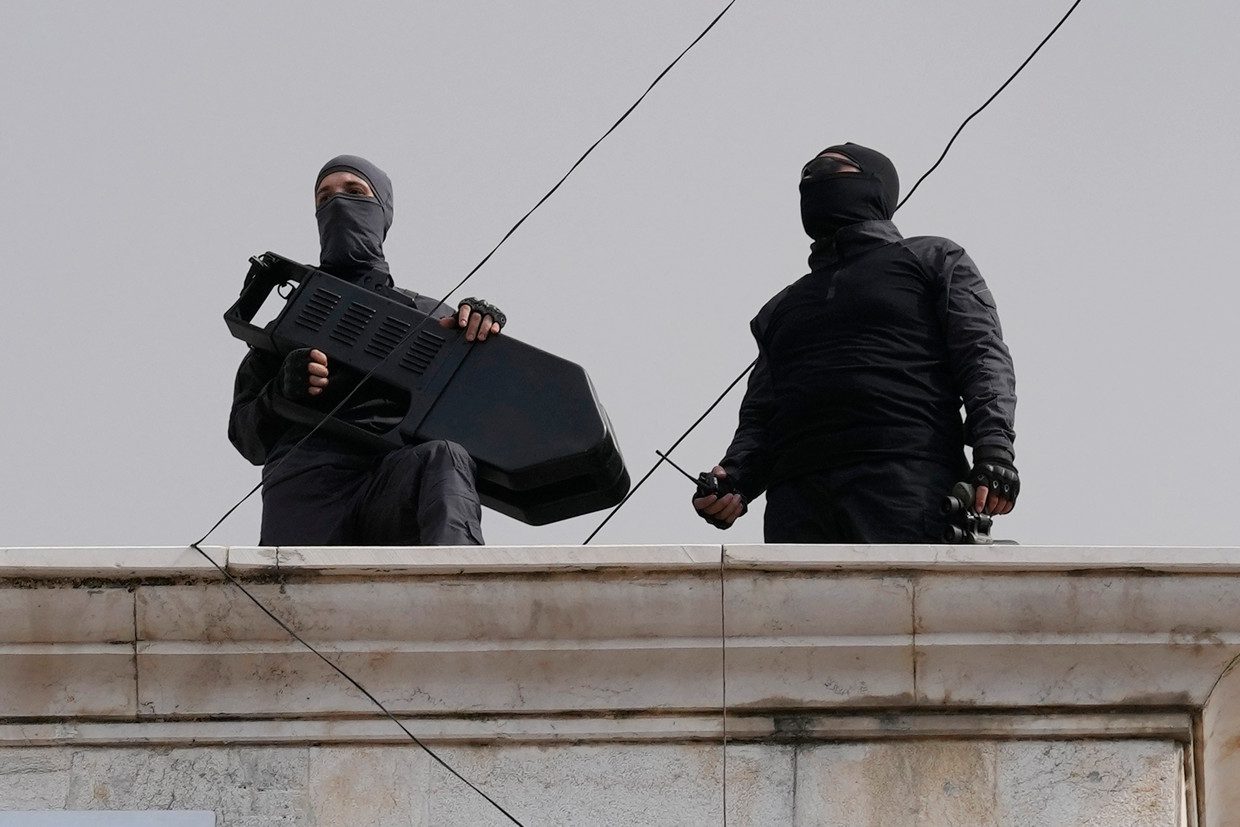 Hezbollah soldiers defend a protest in solidarity with Palestinians in Beirut, Lebanon.  Image by AP