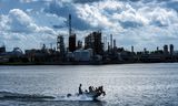 A pleasure boat in the background of the Chemours Teflon factory. 