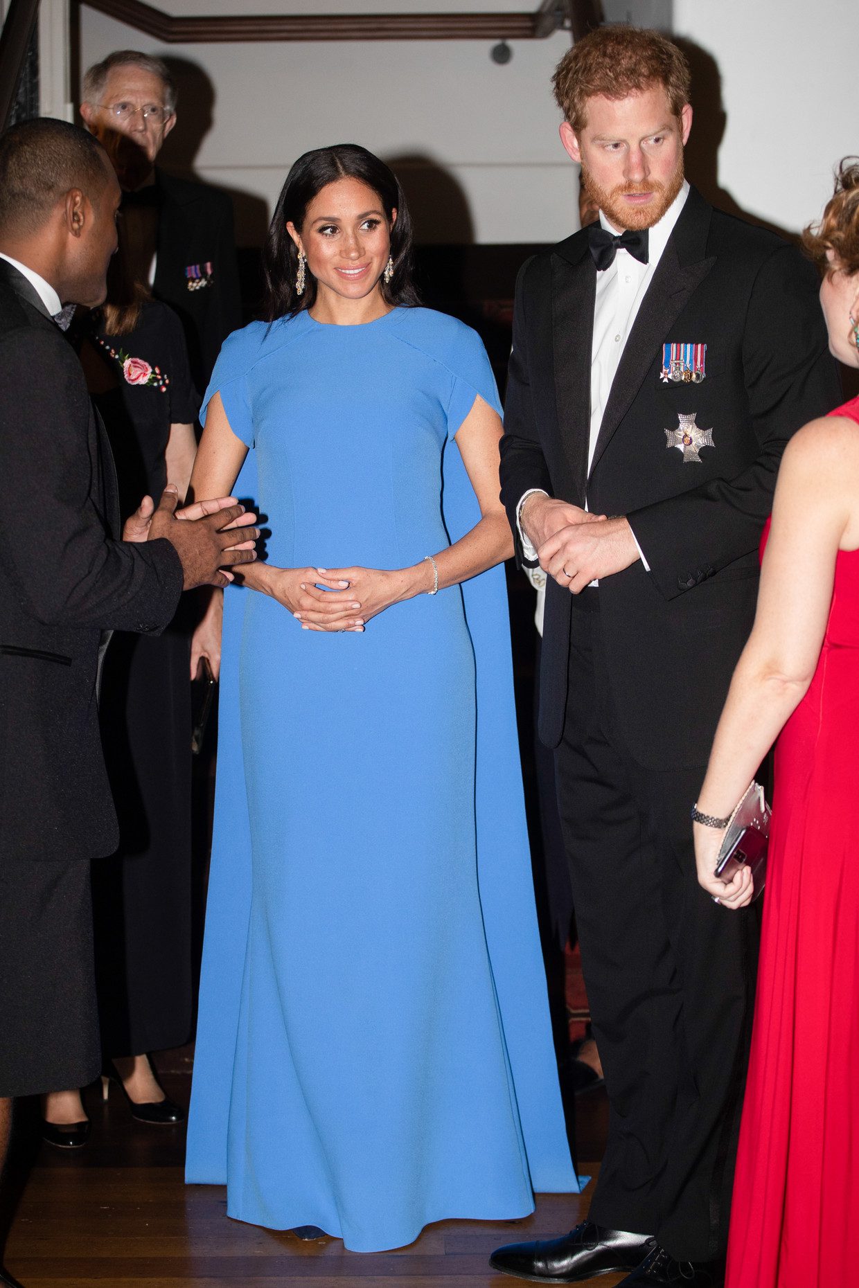 Meghan Markle at a formal dinner in Fiji in 2018. The Duchess of Sussex wears a light blue dress designed by British designer Safia.  Picture wire picture