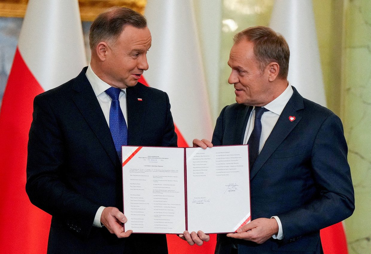 Polish President Andrzej Duda and newly appointed Polish Prime Minister Donald Tusk attend the government's swearing-in ceremony.  Reuters photo