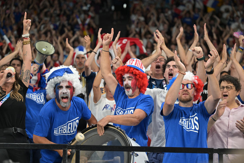 France fans cheer before the men's basketball quarterfinal match between France and Canada during the Paris 2024 Olympic Games at Bercy Arena in Paris on August 6, 2024. (Photo: DAMIAN MAYER/AFP) (Photo: DAMIAN MAYER/AFP via Getty Images)